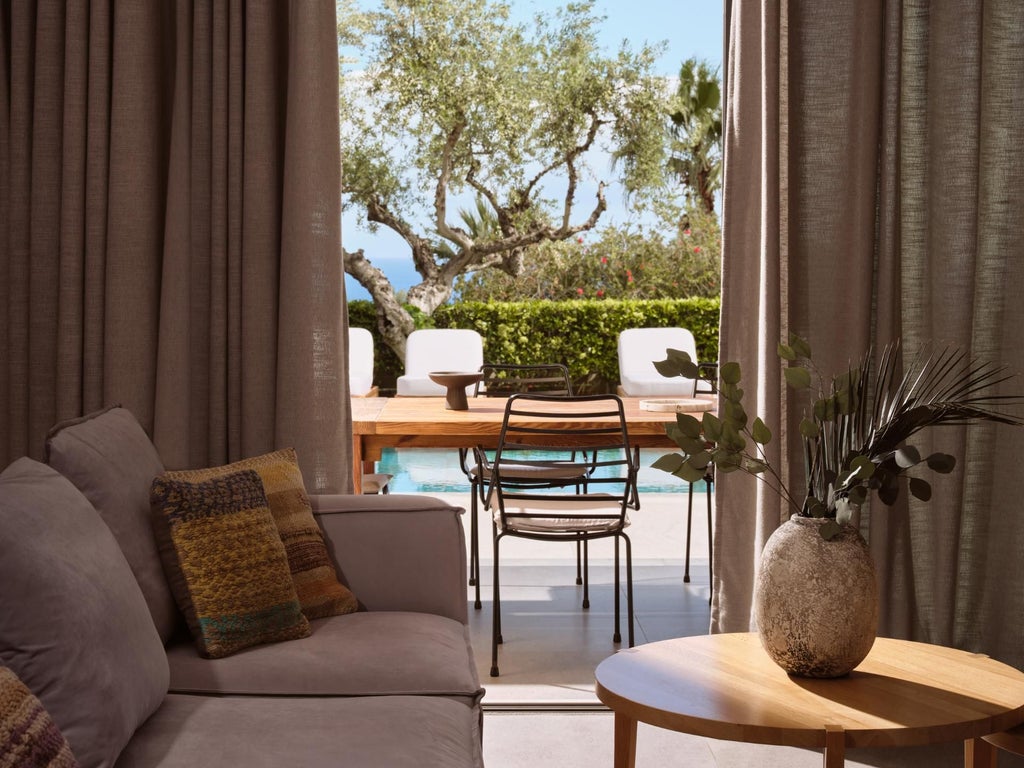 Luxurious white modern villa bedroom with panoramic Aegean Sea view, elegant minimalist design, private terrace, and soft natural lighting in Greece