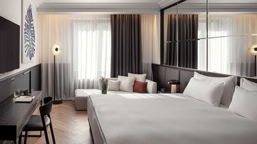 Opulent presidential suite at Almanac X Alcron hotel in Prague, featuring elegant art deco design, plush furnishings, and sophisticated Czech architectural details