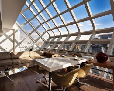 Sleek, modern hotel exterior with glass facade, reflecting São Paulo's skyline, featuring minimalist design and luxurious architectural elements at dusk