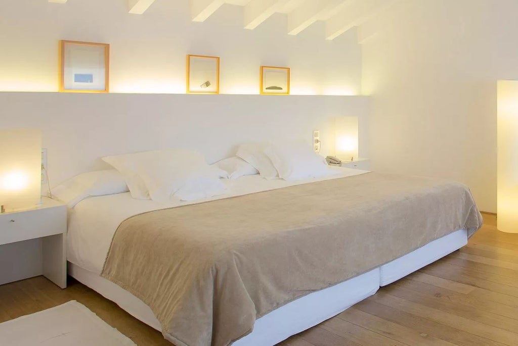 Elegant Doble Deluxe hotel room at Convent de la Missió, featuring minimalist design, soft neutral tones, and premium Mediterranean-inspired decor with natural light