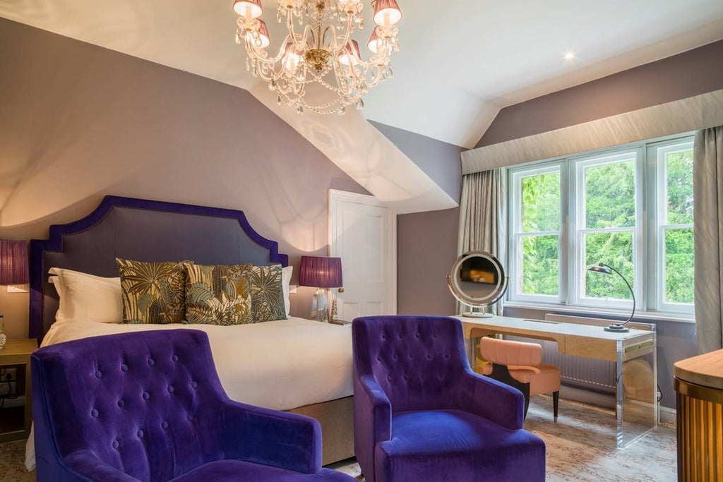 Luxurious hotel room with plush king-sized bed, sophisticated neutral color palette, and elegant contemporary furnishings at Homewood Hotel & Spa