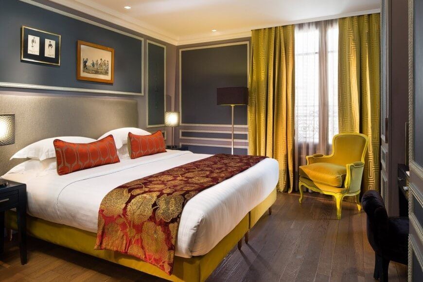 Elegant Parisian superior hotel room with soft beige and gray color palette, plush bedding, luxurious textures, and sophisticated boutique design aesthetic