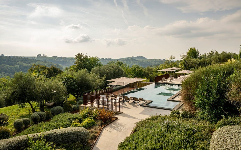 Luxurious Croatian hotel with modern white facade, palm-lined entrance, terrace balconies and scenic coastal mountain backdrop