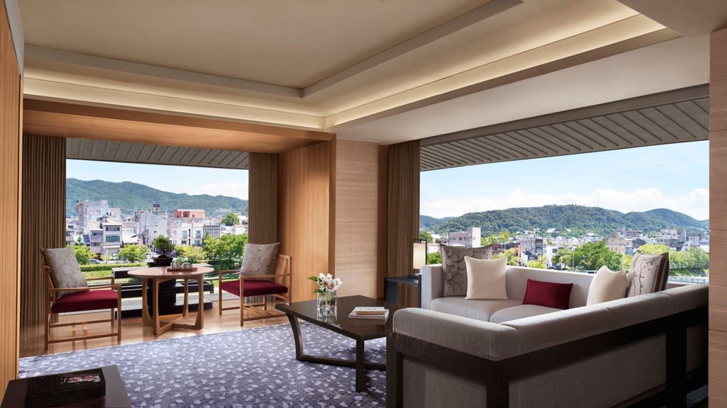 Luxurious hotel overlooking Kyoto's scenic river with traditional Japanese architecture, elegant modern design, and panoramic mountain views at sunset