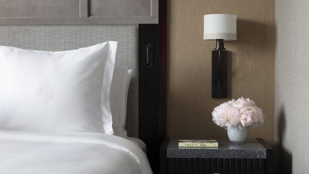 Luxurious Premier Room at Four Seasons Hotel with modern decor, crisp white bedding, city view, and elegant contemporary design showcasing urban sophistication