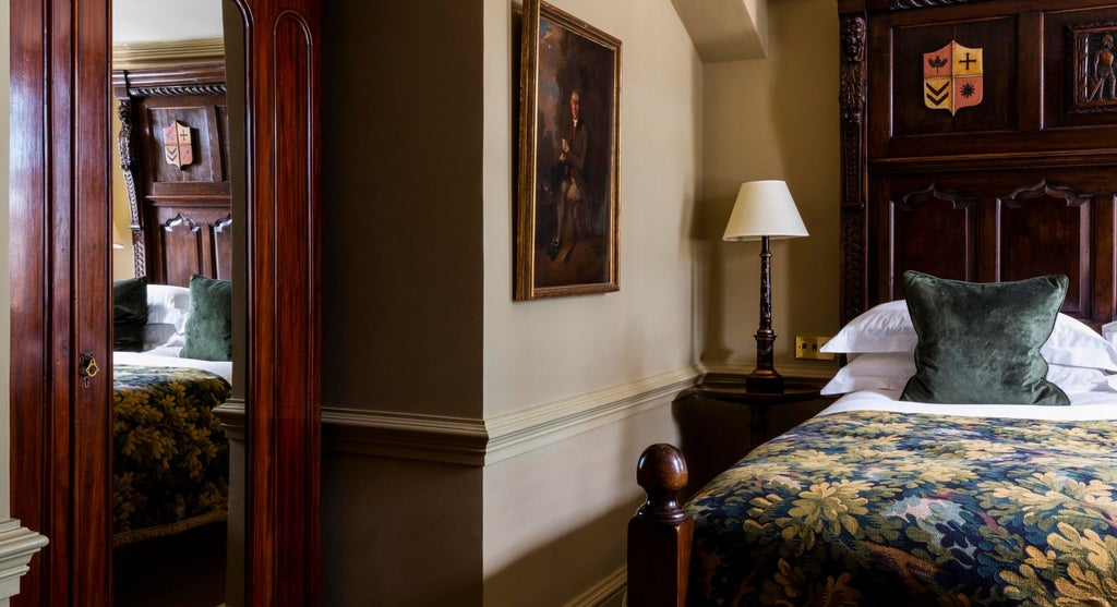 Elegant Superior Double room at Batty Langley's, featuring plush bedding, antique furnishings, and sophisticated period-inspired decor in soft neutral tones