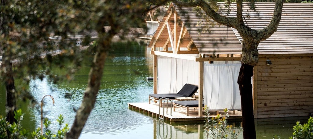 Luxurious bio-pool suite at Sublime Comporta Hotel, featuring minimalist design, natural wood accents, and serene Portuguese coastal landscape view