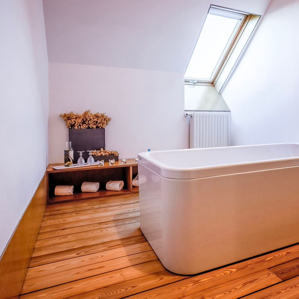 Elegant mountain-view suite with minimalist design, featuring white walls, wooden furniture, and large windows framing scenic Portuguese landscape