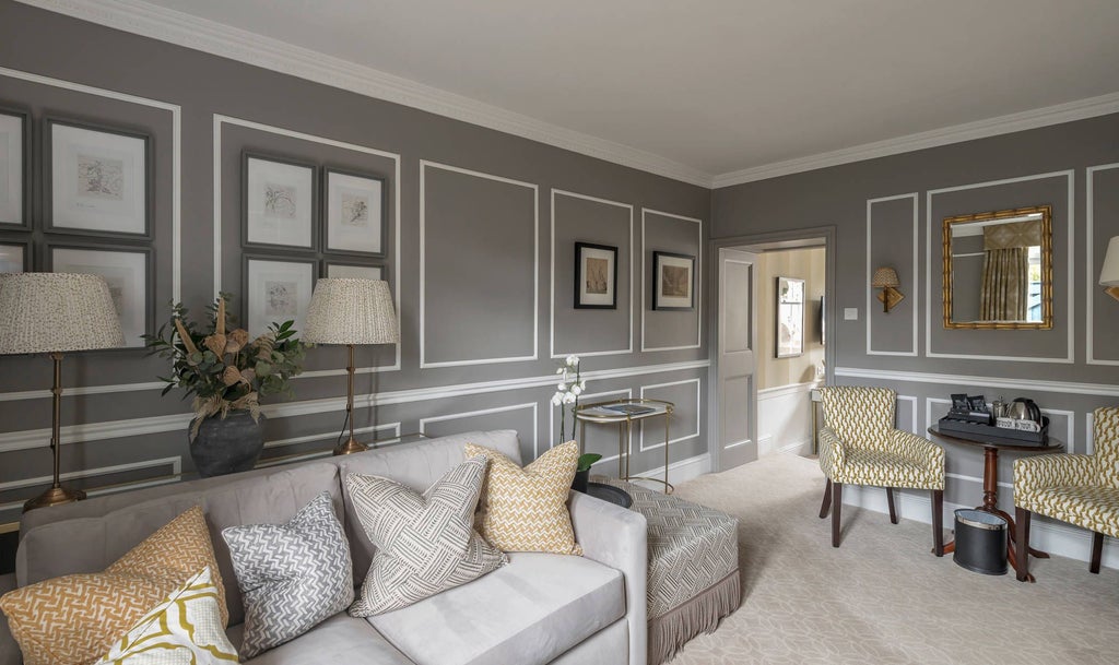 Elegant junior suite at The Royal Crescent Hotel & Spa, featuring plush furnishings, soft neutral tones, and refined Georgian-inspired architectural details in Bath, UK.