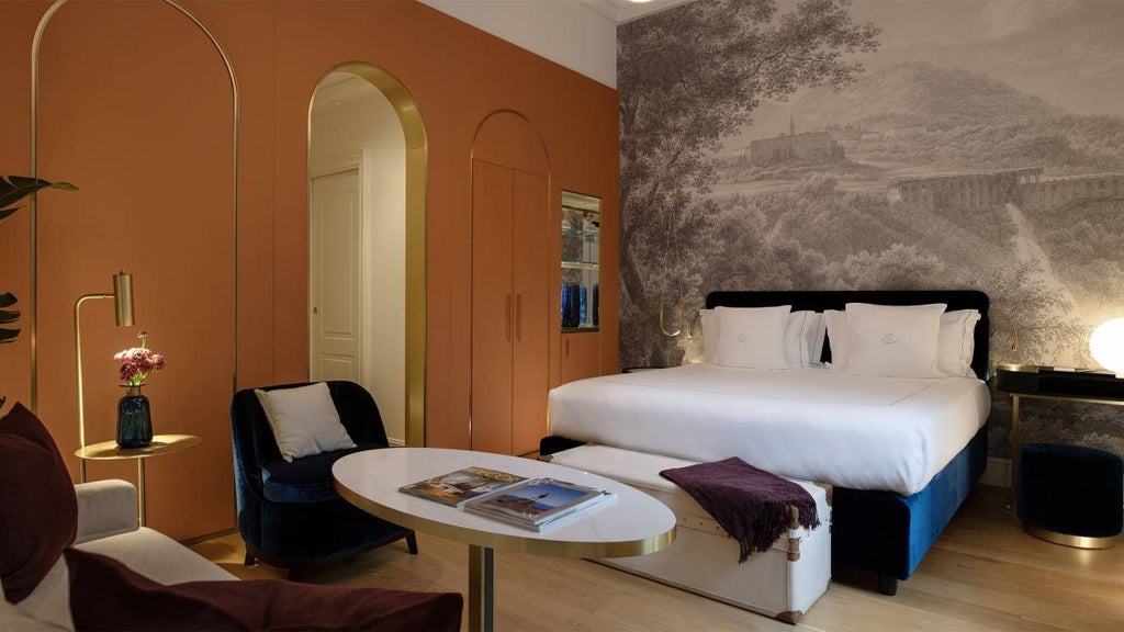 Elegant deluxe junior suite with modern Italian design, featuring plush bed, warm neutral tones, and sophisticated contemporary decor in a luxurious Rome hotel room