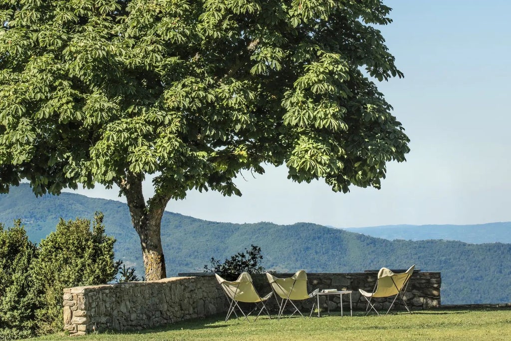 Luxurious Tuscan countryside villa with stone architecture, rolling vineyards, and elegant outdoor terrace overlooking scenic Italian landscape at sunset