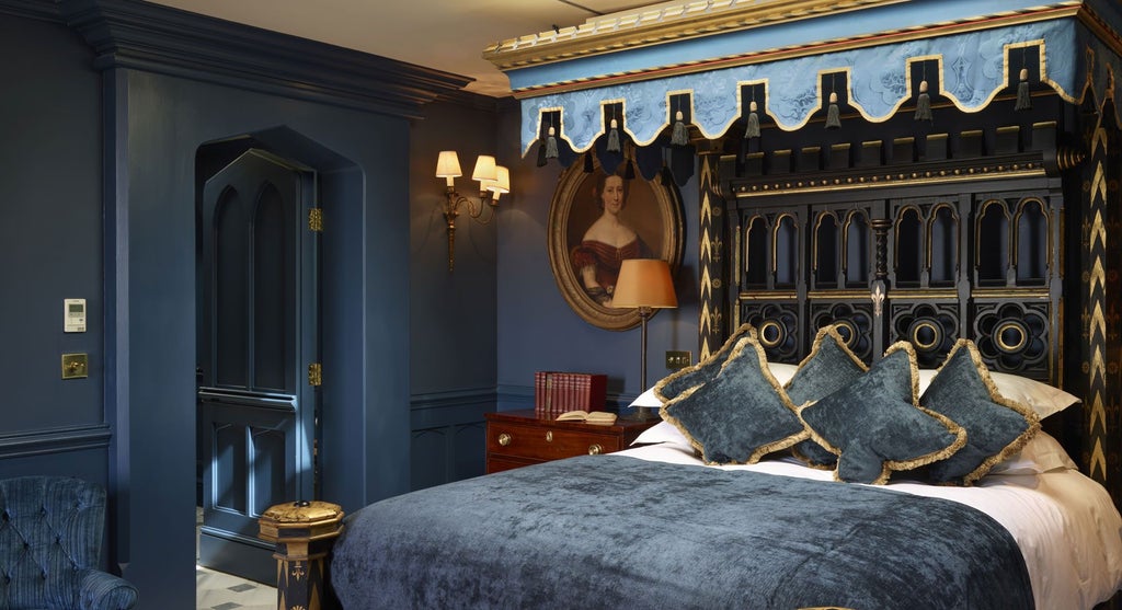 Luxurious boutique hotel bedroom with ornate Georgian-style decor, plush velvet furnishings, and elegant chandelier in a historic UK townhouse setting