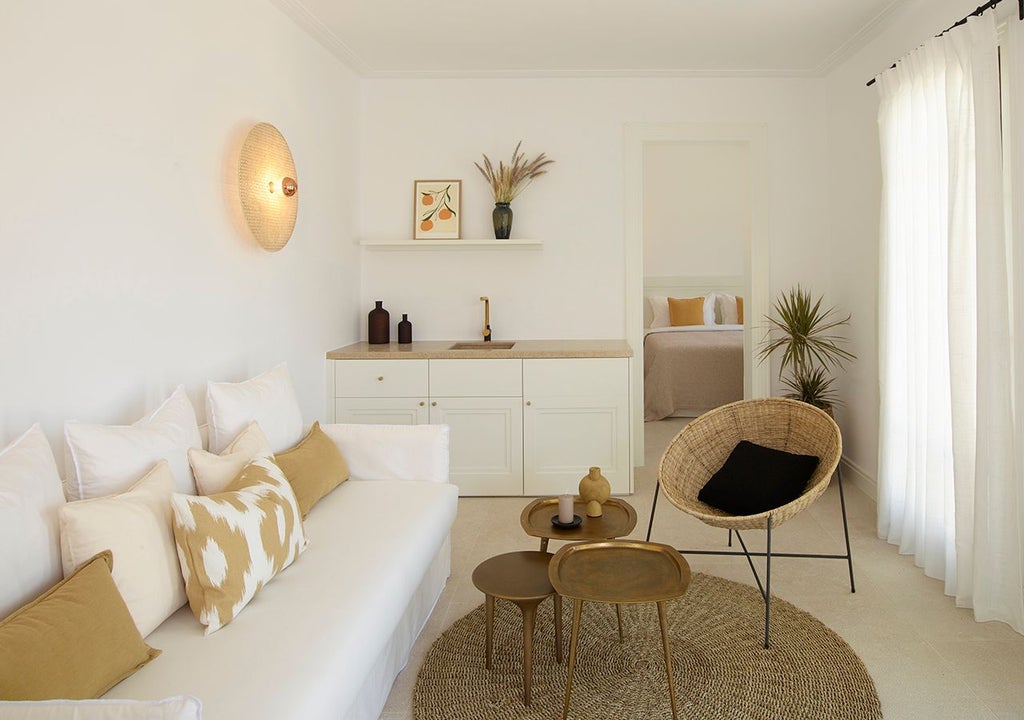 Modern Greek villa bedroom with private heated pool, panoramic Aegean Sea view, minimalist white decor, and elegant sun-drenched Mediterranean design aesthetic