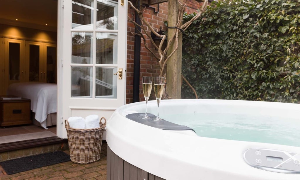 Luxurious hot tub suite at Scenset Hotel & Spa, featuring elegant wooden decor, modern amenities, and a private spa-like atmosphere in the United Kingdom