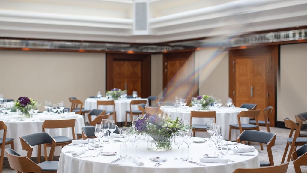 Elegant Art Deco hotel lobby with polished marble floors, crystal chandeliers, and sophisticated modern furniture in Prague's historic city center