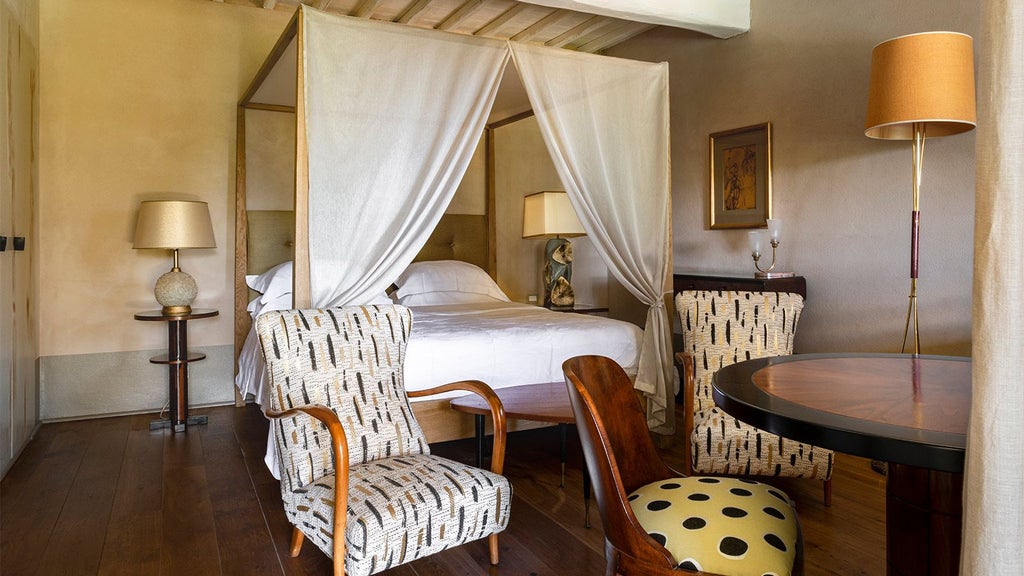 Elegant rustic-chic hotel room with warm wooden floors, minimalist decor, and soft natural light overlooking Tuscan countryside landscape