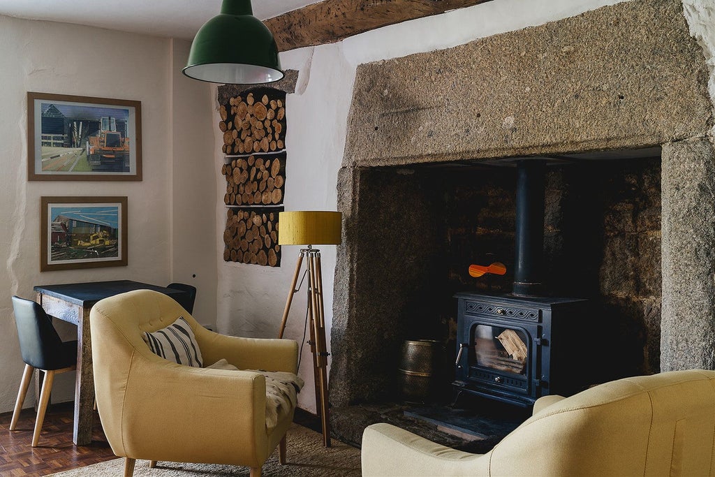 Elegant stone farmhouse with slate roof nestled in lush Devon countryside, showcasing traditional British architectural charm and serene landscape views