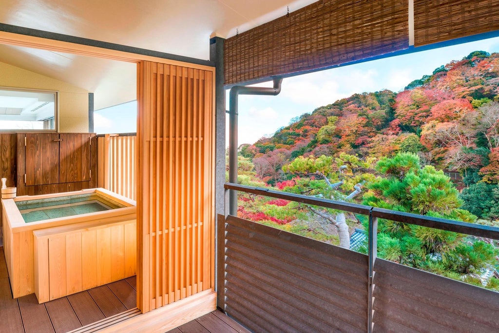 Elegantly designed Suiran Presidential Suite with traditional Japanese aesthetics, rich wood furnishings, and panoramic views of Kyoto's serene landscape through expansive windows