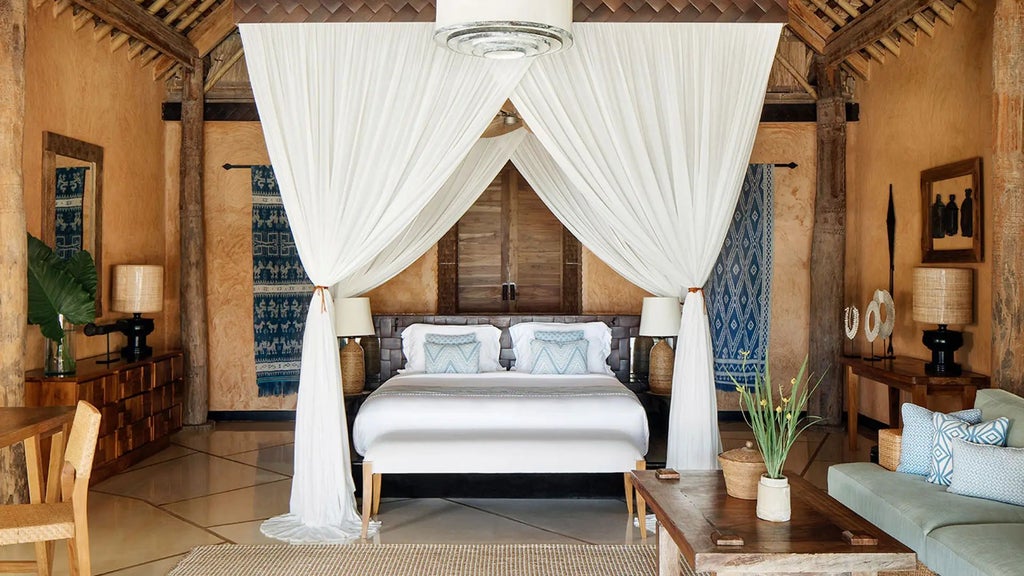 Luxurious spacious Lantoro Villa at NIHI Sumba resort, featuring elegant wood furnishings, panoramic ocean view, and private infinity pool overlooking lush Indonesian landscape