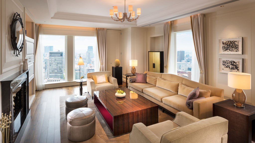 Luxurious hotel room at a five-star Japanese hotel with elegant modern decor, plush king bed, city skyline view, and contemporary minimalist design elements