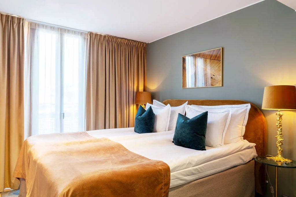 Elegant Stockholm hotel room with minimalist Scandinavian design, soft neutral tones, plush king bed, modern lighting, and expansive city view window