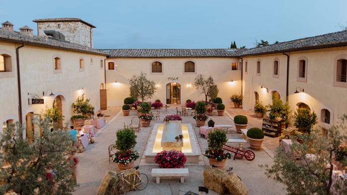 The courtyard of the hotel's restaurant, [Restaurant Name]
