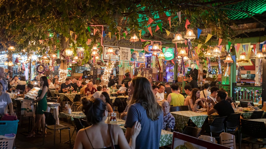 Vibrant Thai street market scene with sizzling woks, colorful spices, and elegant local chef preparing traditional northern Thai cuisine in Chiang Mai