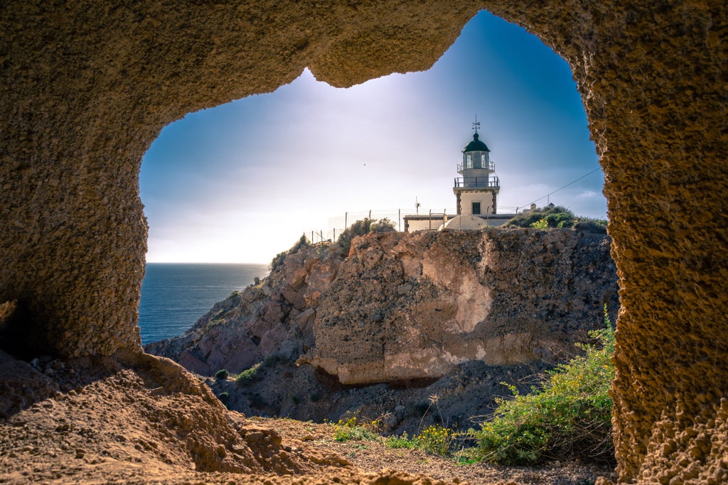 Whitewashed Santorini houses cascading down volcanic cliffs, with blue-domed churches and elegant tourists exploring ancient Akrotiri archaeological site