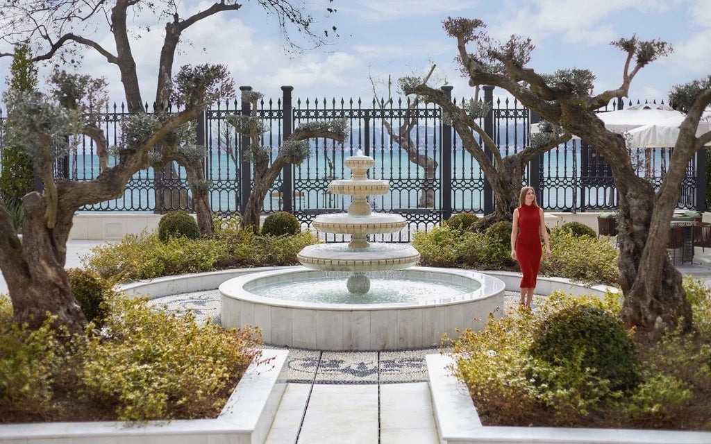 Elegant Ottoman-era mansion with luxurious white facade, traditional Turkish architectural details, and lush green gardens in Istanbul's historic district