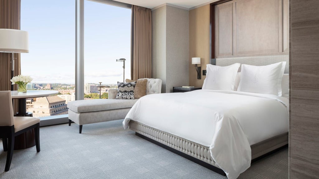 Spacious deluxe accessible hotel room with elegant contemporary design, plush king bed, city view, and modern accessibility features at Four Seasons hotel in Boston