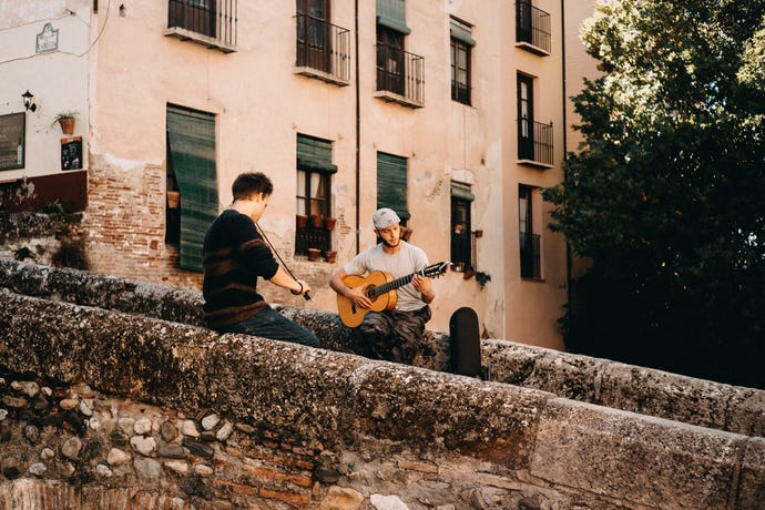 Hear music in the streets of Granada
