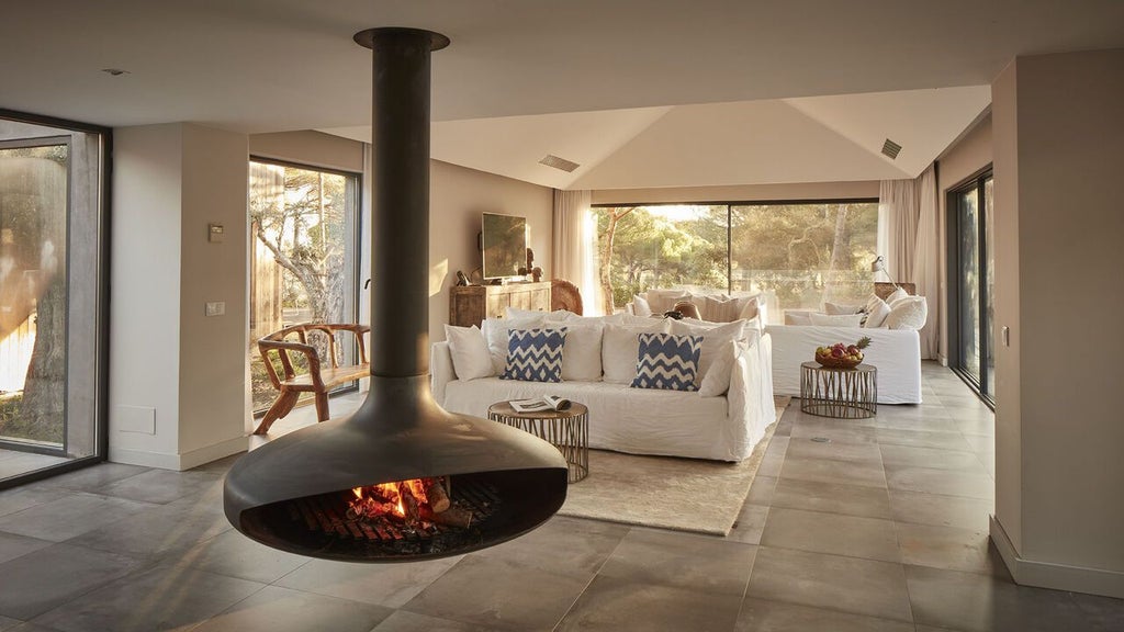 Minimalist bio-pool suite at Sublime Comporta Hotel, featuring elegant white decor, sleek furniture, and expansive natural light with panoramic landscape views