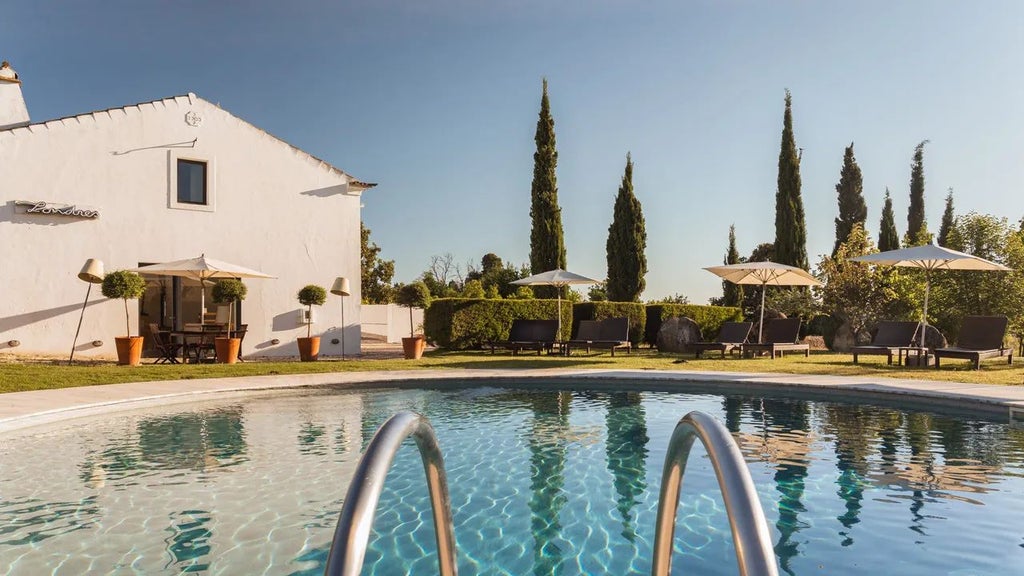 Rustic stone villa nestled in lush Portuguese countryside, featuring elegant terracotta roof, verdant gardens, and panoramic rolling hills of rural scenset landscape.