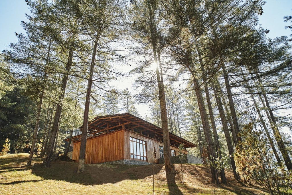 Rustic luxury lodge nestled in Bhutanese forest with traditional wooden architecture, floor-to-ceiling windows, and mountain views