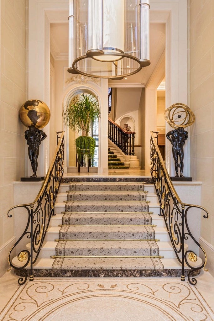 Elegant Parisian luxury hotel facade with ornate white exterior, classic French architecture, and refined architectural details of Hôtel San Régis