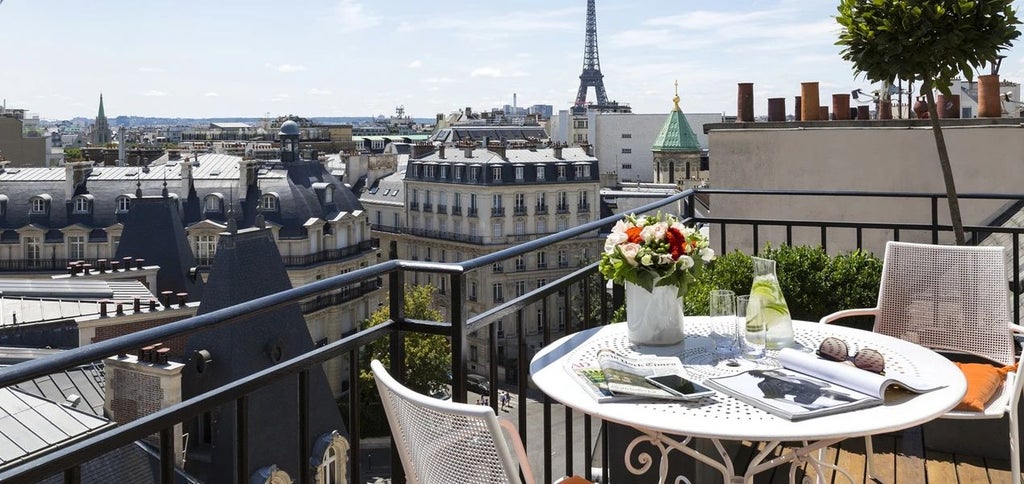 Elegant Parisian hotel facade with ornate balconies, classic French architecture, and refined stone exterior nestled in a prestigious urban setting