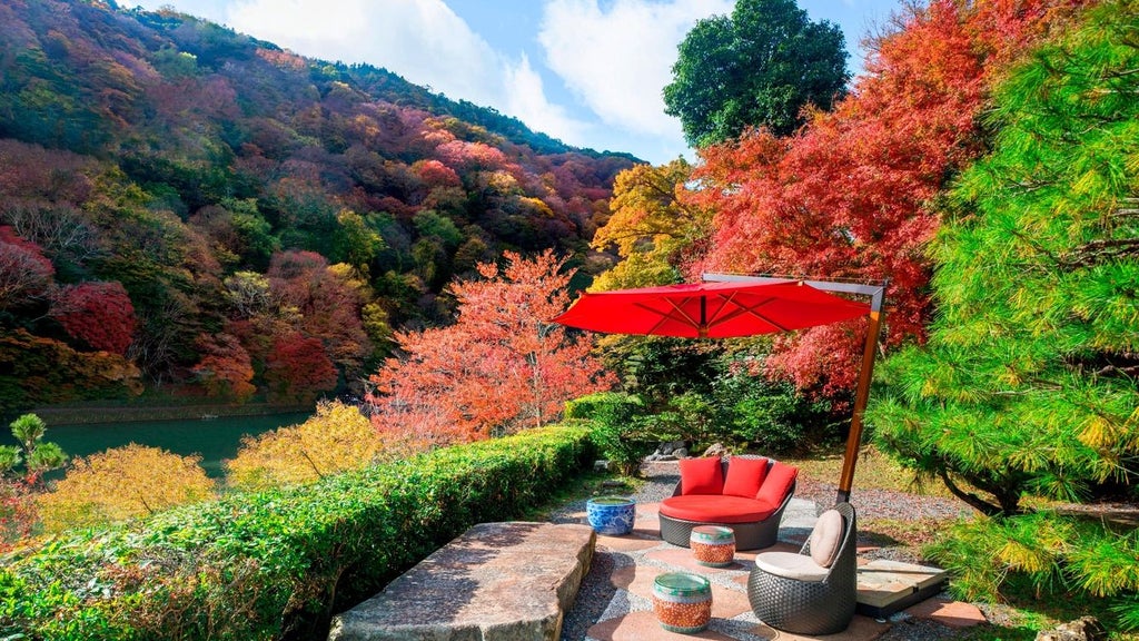 Elegant traditional Japanese ryokan-style luxury hotel nestled by a serene river with lush gardens, blending modern sophistication and historic Kyoto architectural charm