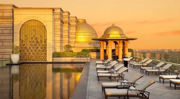 Luxurious facade of prestigious palace-style hotel with elegant architecture, grand entrance, and opulent exterior in New Delhi, India, showcasing refined hospitality