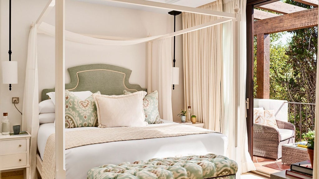 Luxurious Marbella Club suite with panoramic sea views, elegant white-and-blue color palette, plush king bed, and modern Mediterranean-inspired design