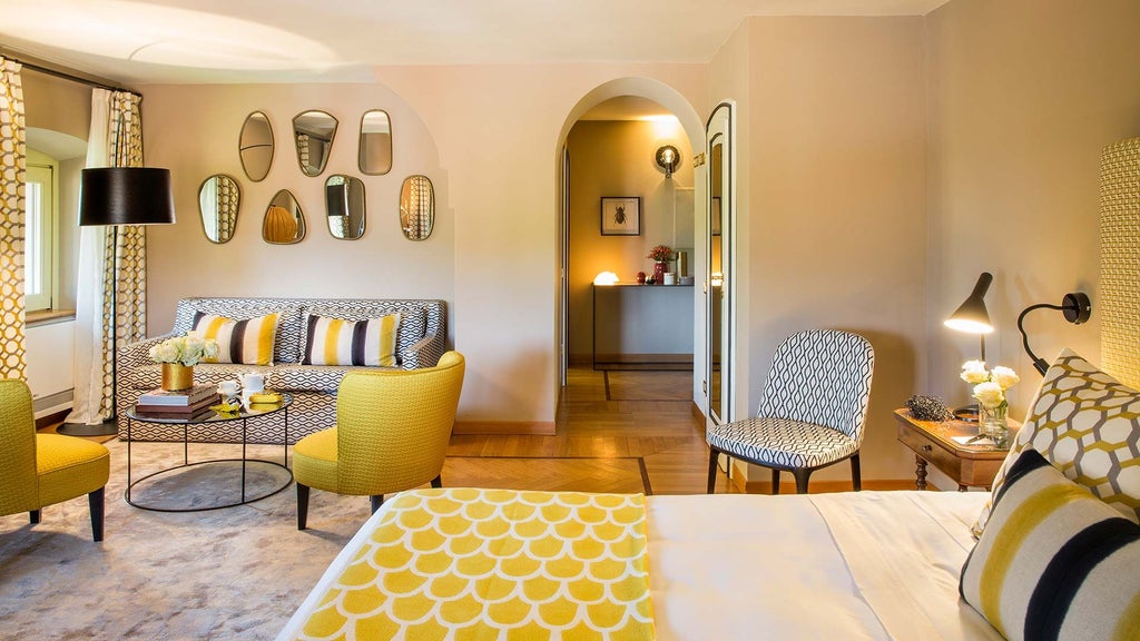 Elegant deluxe hotel room with soft neutral tones, plush bedding, modern Italian furnishings, and panoramic vineyard views in scenic scenset landscape