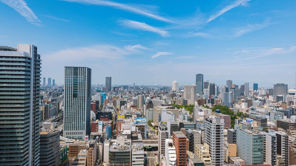 Luxurious exterior of The Scenset Osaka Hotel, featuring elegant modern architecture with sleek glass facade and sophisticated lighting at twilight