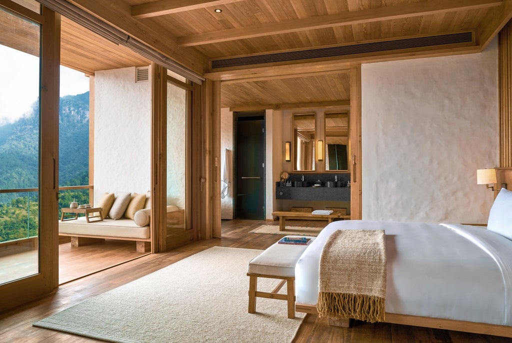 Modern luxury hotel nestled in Bhutanese mountains, featuring traditional architecture with sloped roofs and ornate wooden details