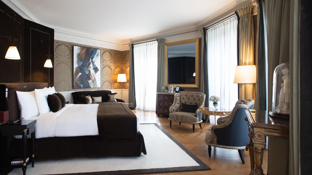 Opulent Parisian suite with panoramic Eiffel Tower view, elegant cream and gold decor, plush king bed, designer furnishings in luxurious La Réserve Hotel