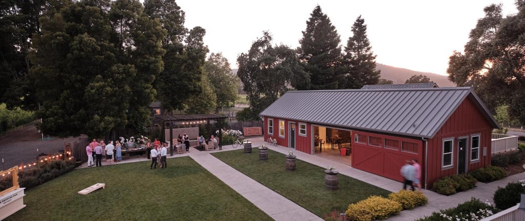 Elegant boutique hotel with white exterior, featuring French doors, wooden shutters and manicured gardens in Napa Valley wine country