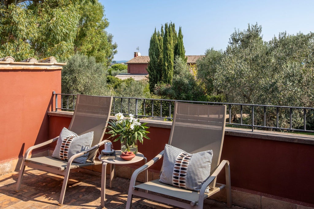 Elegant Italian deluxe terrace room with rustic wooden furniture, soft neutral tones, and panoramic view of scenic countryside landscape