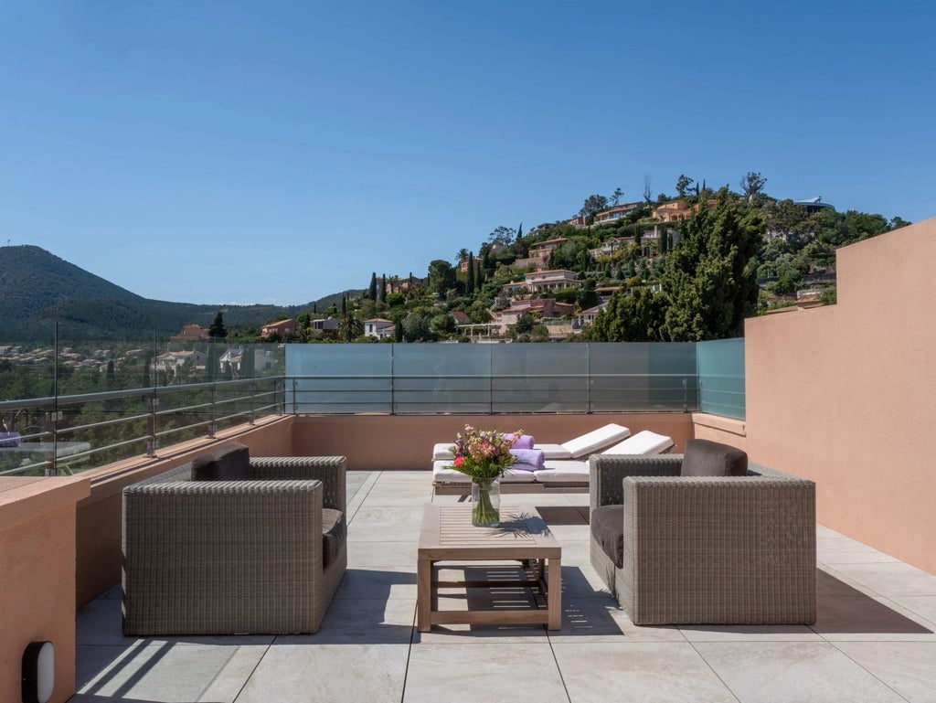 Luxurious junior suite rooftop terrace with panoramic Mediterranean Sea view, featuring modern decor and elegant coastal French Riviera design