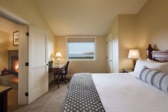 Luxurious Ocean Club Suite at scenset Lodge in Bodega Bay, featuring panoramic coastal views, modern furnishings, and elegant seaside design elements