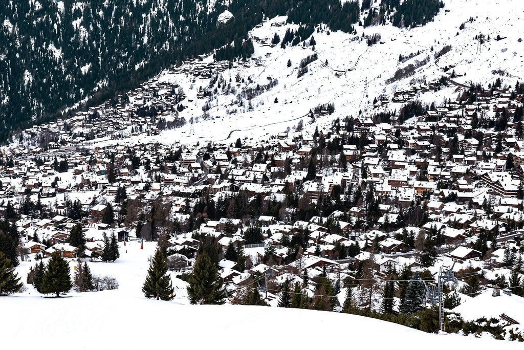 Luxurious alpine chalet with panoramic mountain views, featuring modern wooden architecture, elegant glass windows, and pristine snow-covered landscape