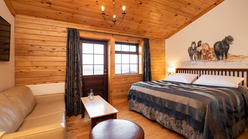 Rest in the cozy interiors of Hotel Rangá's log cabins