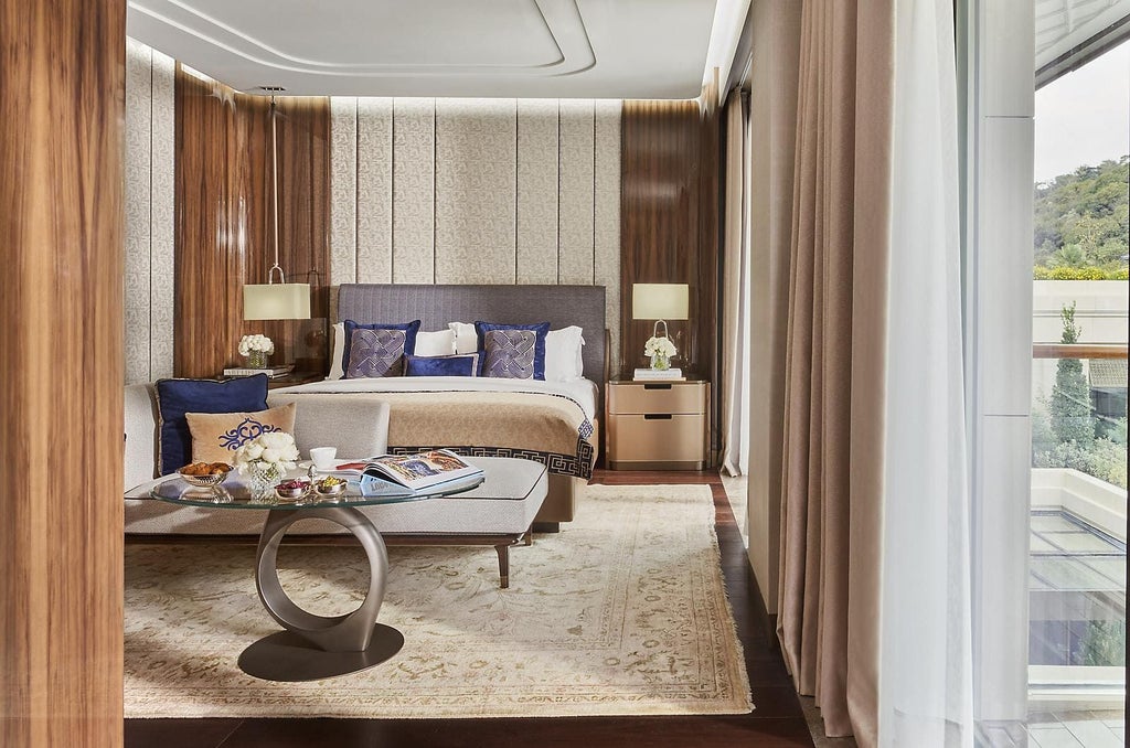 Luxurious Deluxe Room with panoramic Bosphorus views, elegant contemporary design, plush king bed, and modern Turkish-inspired decor in warm neutral tones